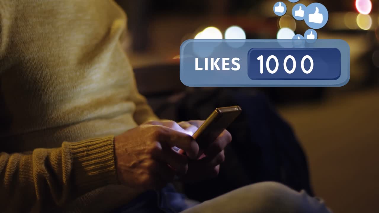 Man sitting on a bench while typing on his phone 4k