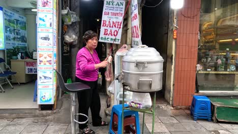 woman cooking at a street food stall