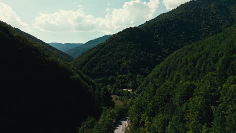 a mountain range with a road running through it in rogova canyon in kosovo east europe