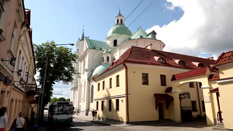 grodno, belarus. famous landmark is st. francis xavier cathedral at summer day. view from karla marksa street