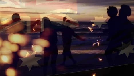 animation of waving flag of australia over group of friends having fun on the beach