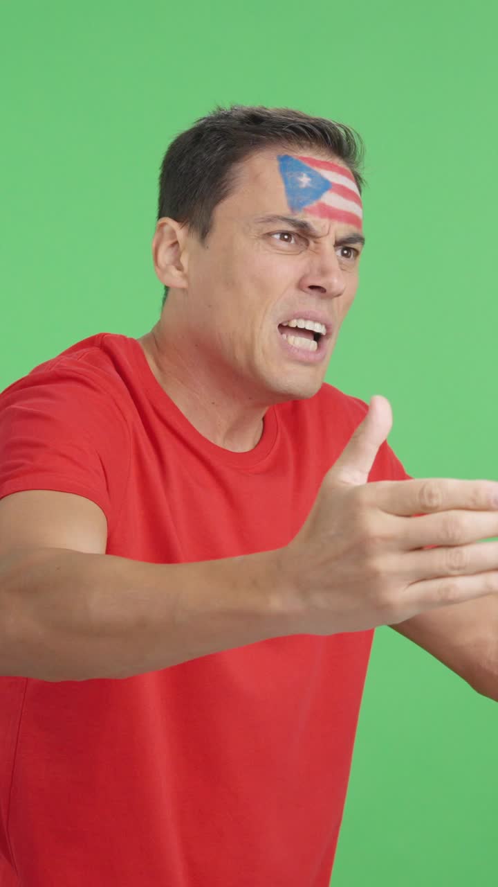 Man cheering for Puerto Rico, angry with the decision of referee