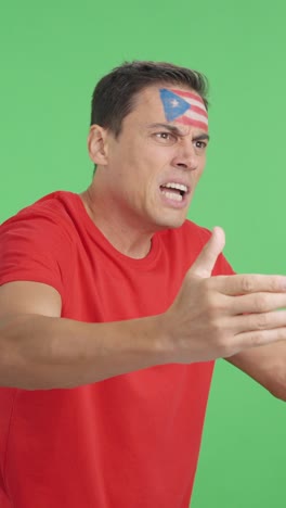 man cheering for puerto rico, angry with the decision of referee