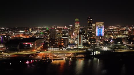 louisville, kentucky skyline at night with drone video circling