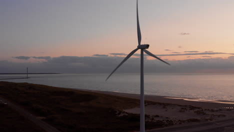 windturbines during sunset on the island neeltje jans, the netherlands