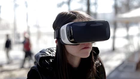 serious woman in vr headset on street