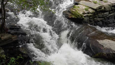 Waterfall-near-Covered-Bridge,-Thomas-Mill-at-the-Wissahickon-Creek