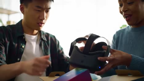 excited moments of unboxing: two friends discover a virtual reality headset together, sharing joy and anticipation as they explore new technology