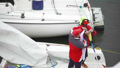 sailors preparing sailboat