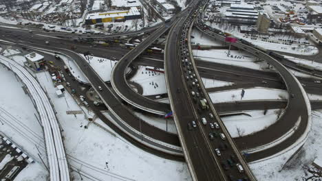 aerial view cars driving on winter highway. car traffic on snowy freeway road