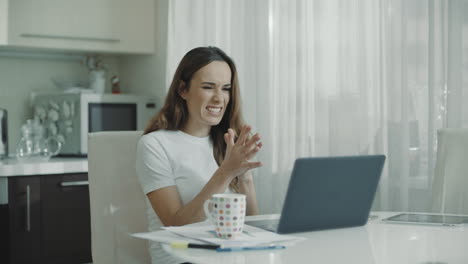 Happy-woman-working-laptop-computer-at-home.-Excited-woman-reading-good-news