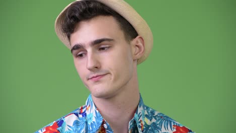 young handsome tourist man looking bored