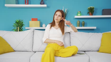 Paranoid-young-woman-looking-around-at-home.