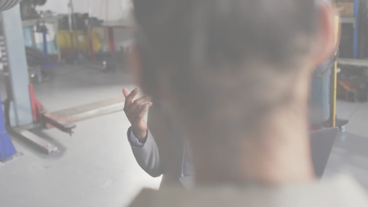 Technician clicking laptop and analyzing auto codes via transparent overlay for diagnostics