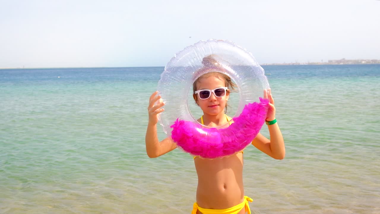The woman is riding on a swing. Selective focus.