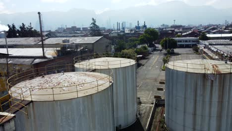 among the relics of industry, four enormous rusty water tanks stand as imposing monuments to the factory's former operations