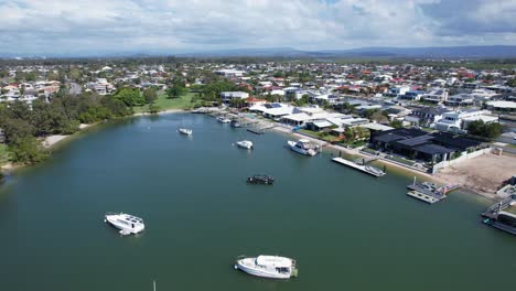 paradise point suburb, boats and yachts in the canal in queensland, australia - aerial shot