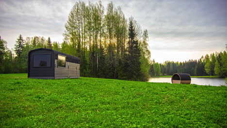 Morning-to-afternoon-time-lapse-of-a-camping-trailer-by-a-picturesque-lake