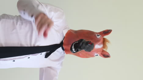 man in a horse mask business suit