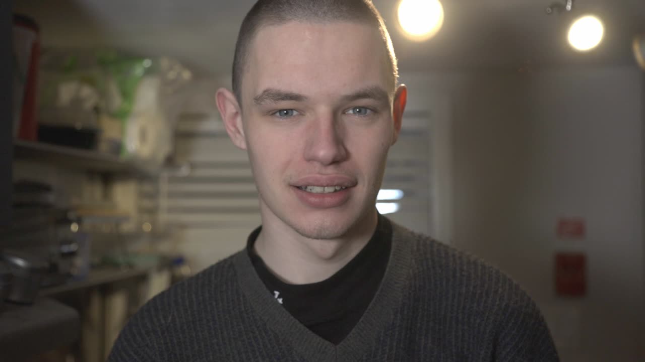 A Young Man Making A Smirk Face While Looking At The Camera - Closeup Shot
