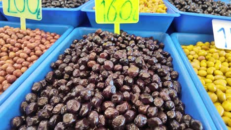 various olives displayed at market