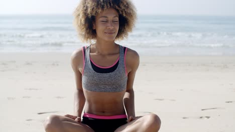 Fit-Woman-Sits-On-The-Beach