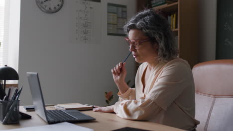Woman Studying on Laptop
