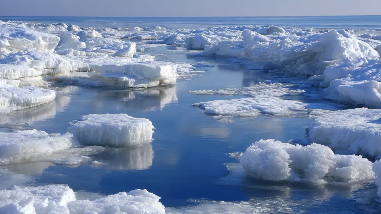 A Serene Winter Landscape Depicting Tranquil Ice Floes and Reflective Waters Under a Clear Sky, Capturing the Beauty of a Frozen Seascape in Harmony with Nature's Stillness