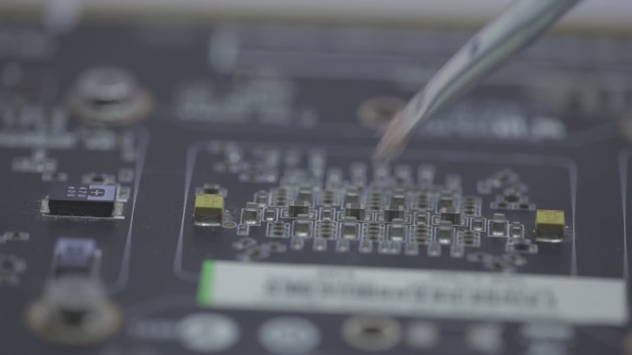 Cleaning A Motherboard And Its Components With A Small Paint Brush - selective focus