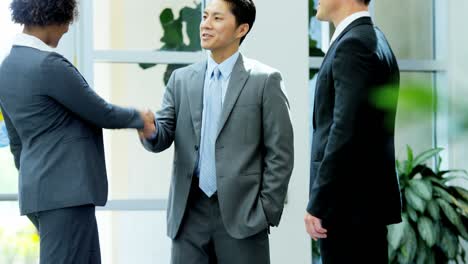 multi ethnic male female business consultancy team handshake