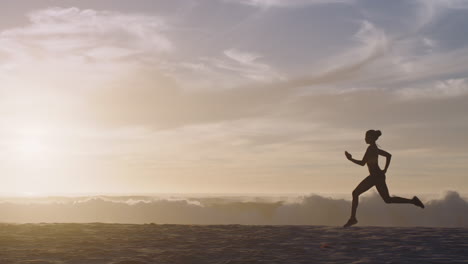 fit, active and healthy woman running at sunset