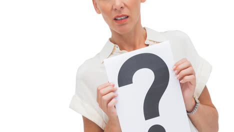 confused caucasian businesswoman holding question mark sign