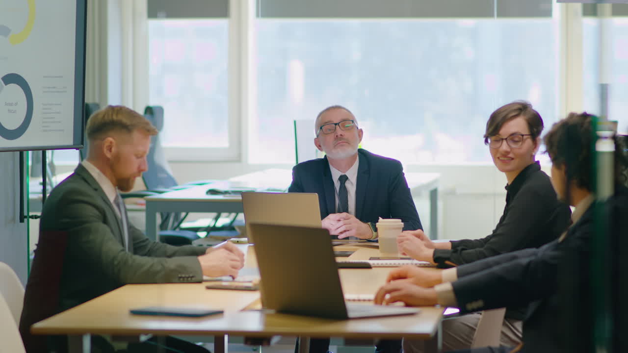 Business Team Having Meeting with Senior CEO