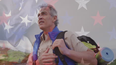 animación de la bandera estadounidense sobre un hombre caucásico mayor caminando por las montañas