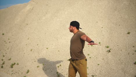 man exercising outdoors in a sandy area