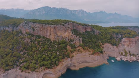 coastal mountain scenery with boat