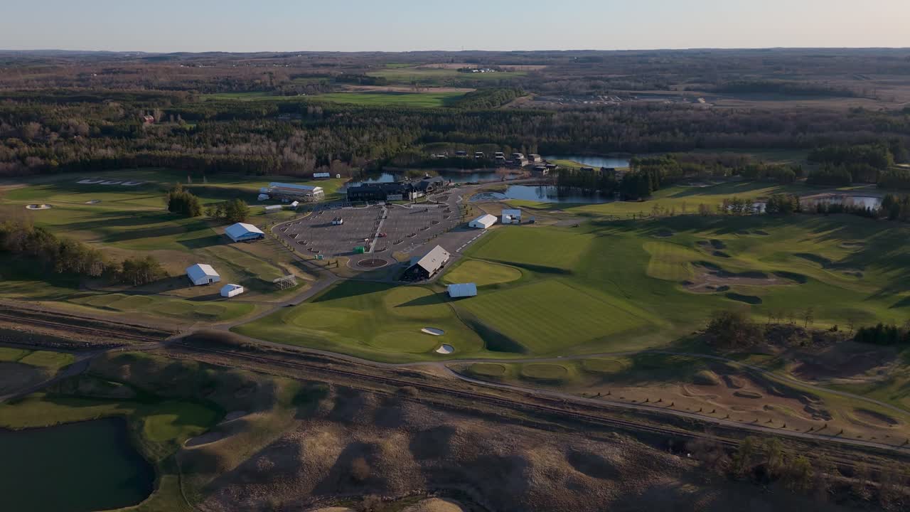 Ivy Electric Vehicle Charging Station Across The TPC Toronto At Osprey Valley Golf Course In Caledon, Ontario, Canada. Aerial Drone Shot