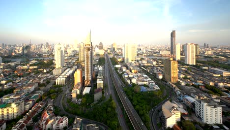 trident of sathorn road at sunset, taksin bridge, bangkok city, thailand