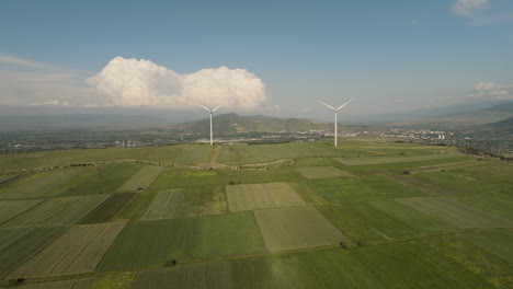 wind turbine generators above picturesque field countryside, georgia