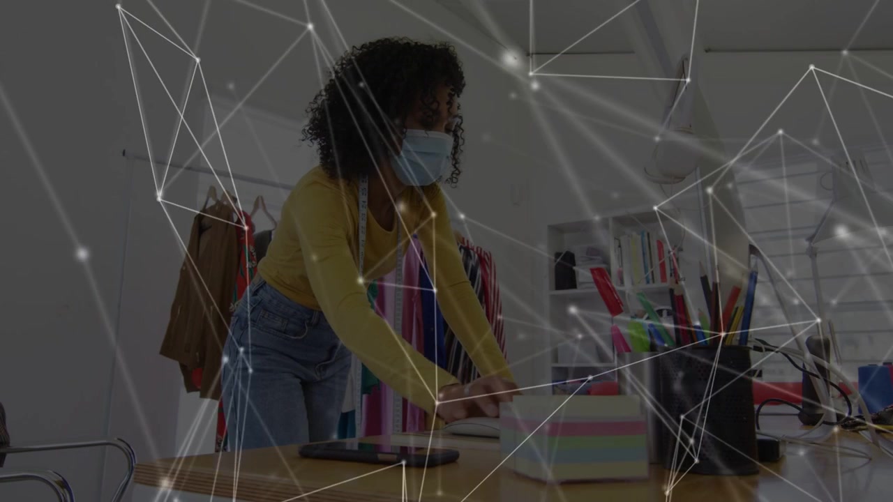 Woman fashion designer arranging sticky notes and typing for work, tapping activating network