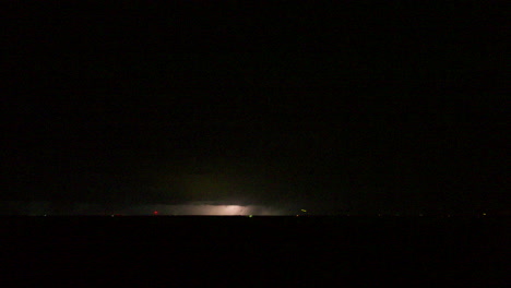 strobe lightning flashing through a nighttime storm