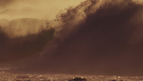 glistening offshore waves at golden hour, slow motion shot with mist rising in the pacific ocean, dramatic lighting