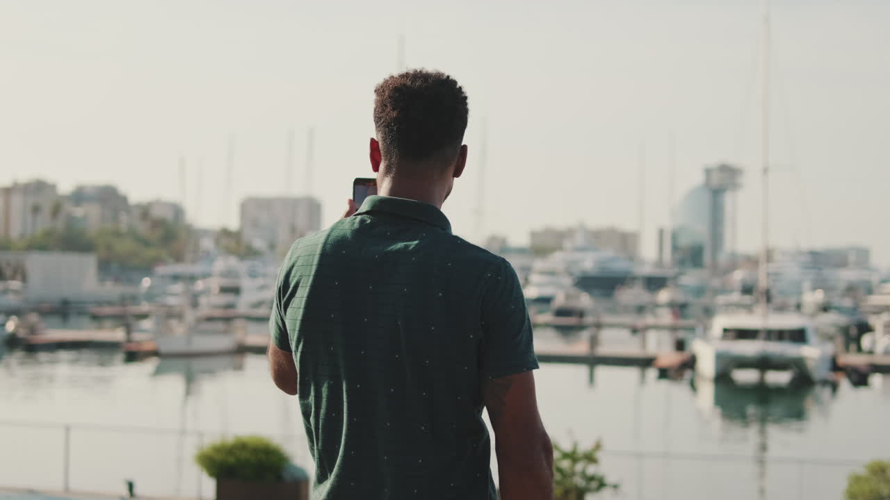 Man Taking Photos in Harbor