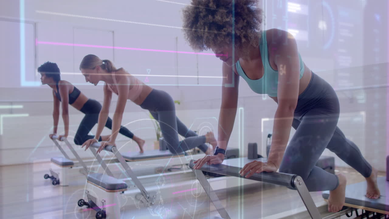 Women exercising on reformer machines with digital data overlay animation