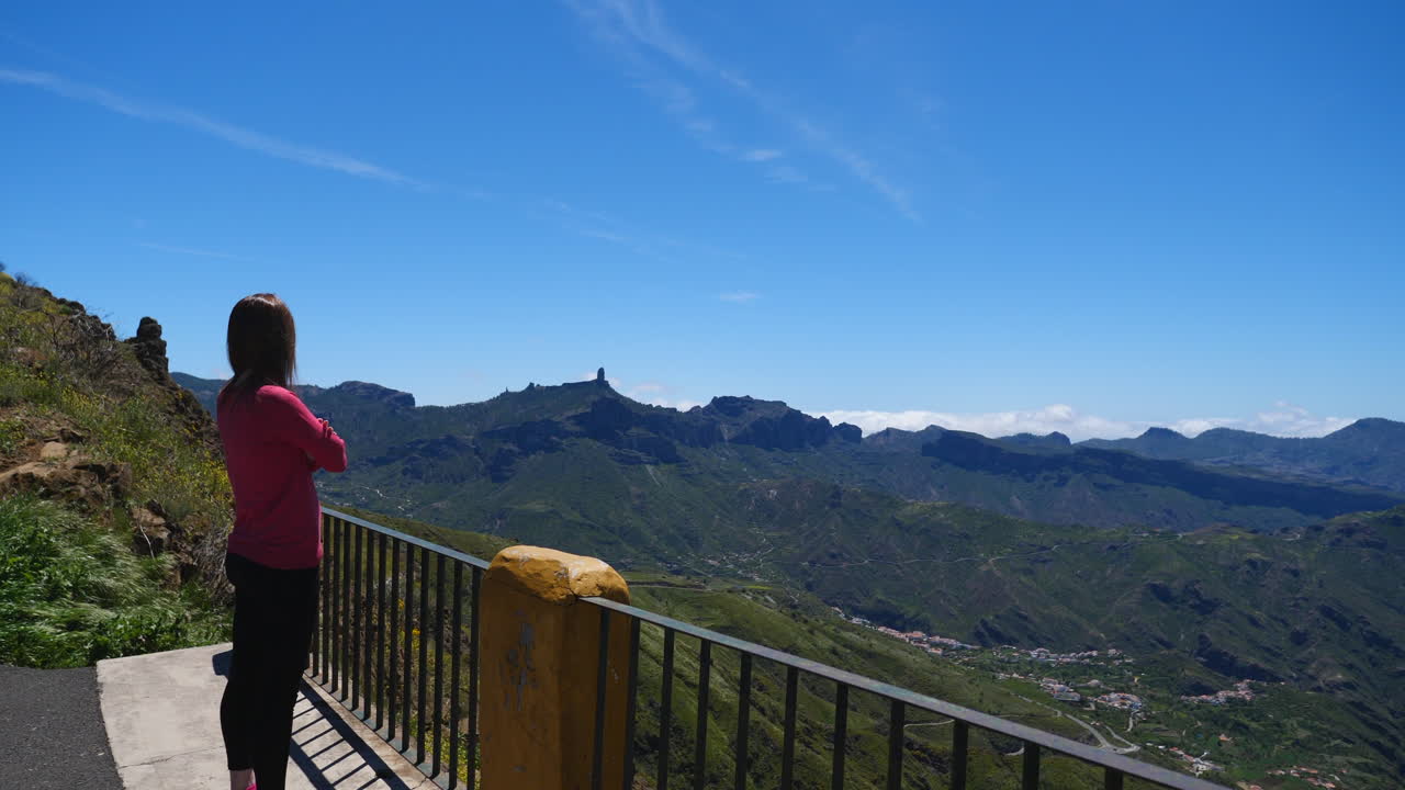 Woman on a viewpoint enjoying the beautiful mountain landscape of Gran Canaria, Canary Islands