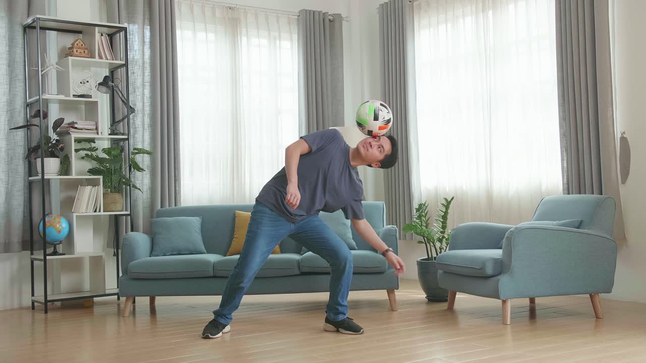 Asian Man Show Skill With Soccer Ball In Living Room, Soccer Freestyle