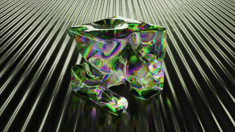 iridescent glass cube on reflective surface