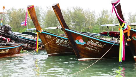 colorful boats docked in serene krabi waters