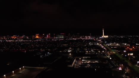 super wide aerial dolly shot of the central and north areas of the las vegas strip at night