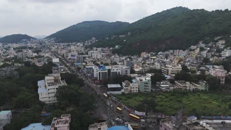 A wide overhead shot of Vijayawada, where the dense city environment is balanced by the scenic greenery and hills.